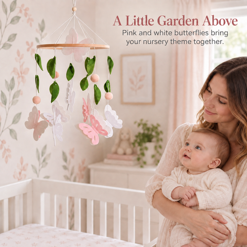 Pink and white butterfly baby mobile displayed in a garden inspired nursery