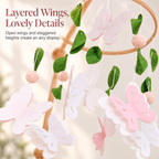 Layered butterfly wings with green felt leaf details