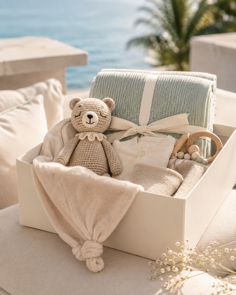 Thoughtful baby essentials arranged in a gift box